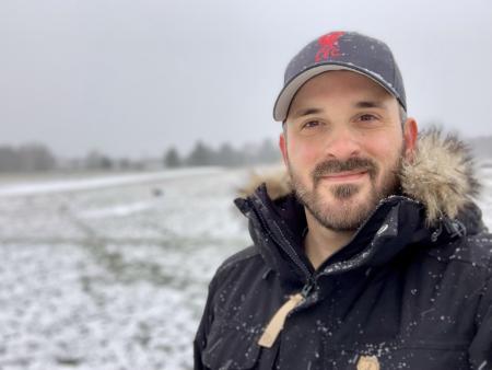 Matt Pietro wearing Liverpool hat