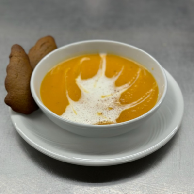 Sweet potato soup topped with cappucino foam and ginger snaps