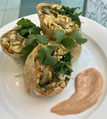 Pan-Seared tempeh and egglplant spring roll with harissa lime sauce