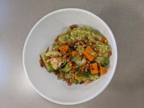 Pea risotto with balsamic roasted brussel sprouts, sweet potato, and candied pine nuts
