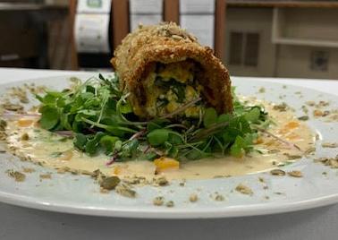 Pumpkin seed encrusted eggplant rollatini with apple cider cream sauce<br>