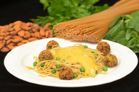 Whole grain spaghetti with curried butternut squash sauce and quinoa falafel balls