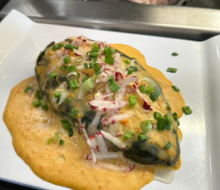 Stuffed poblano pepper with ancho chile carrot sauce