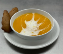 Sweet potato soup topped with cappucino foam and ginger snaps