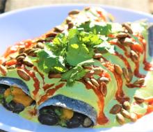 Charred butternut squash enchiladas with black beans and kale